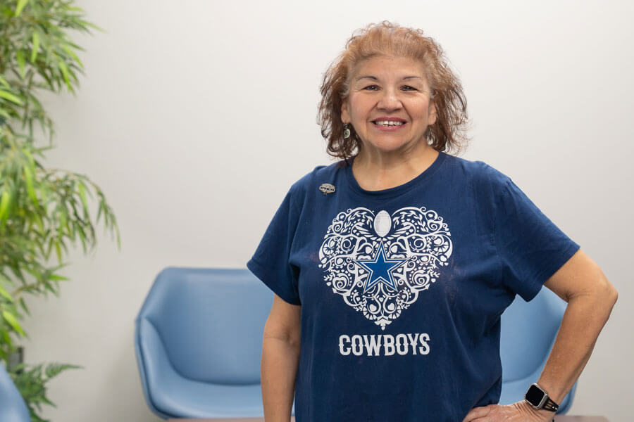 Photo of Rosie wearing a cowboys shirt.