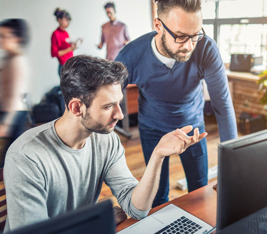 Instructor and student at a computer