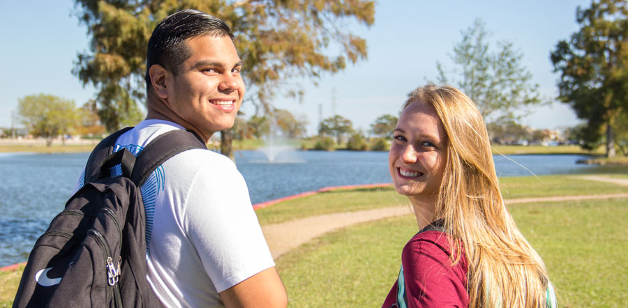 Collegiate High School students outside by the pond