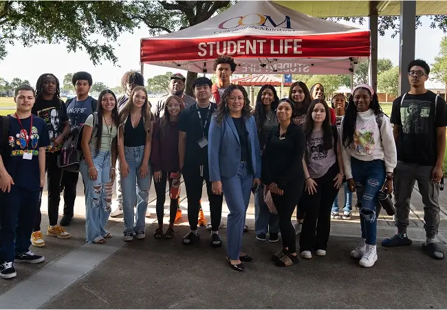 Outside photo of Dr. Brewer with dual credit students