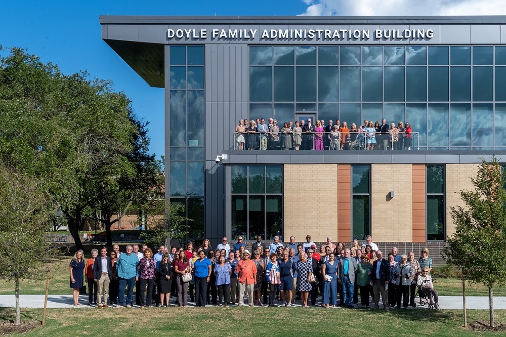 Community leaders, COM officials and faculty and staff joined the Doyle family to unveil the Doyle Family Administration Building during the College’s formal naming ceremony on Monday, October 25. 