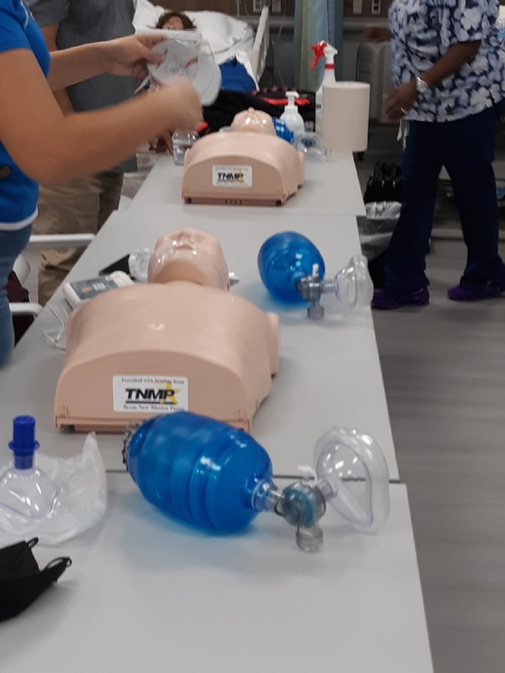 CPR students practice on new training mannequins provided by funding through Texas New Mexico Power.