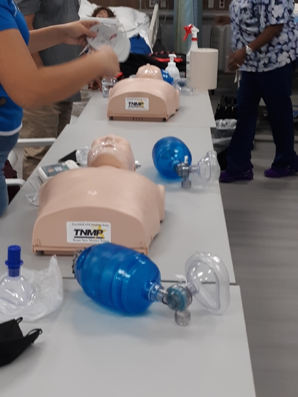 CPR students practice on new training mannequins provided by funding through Texas New Mexico Power.