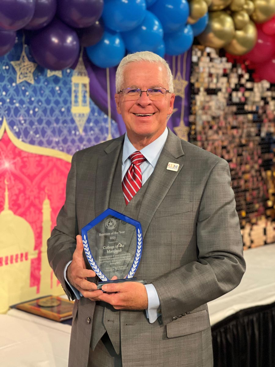 College of the Mainland President Dr. Warren Nichols accepts the 2021 Large Business of the Year award from the Texas City-La Marque Chamber of Commerce.