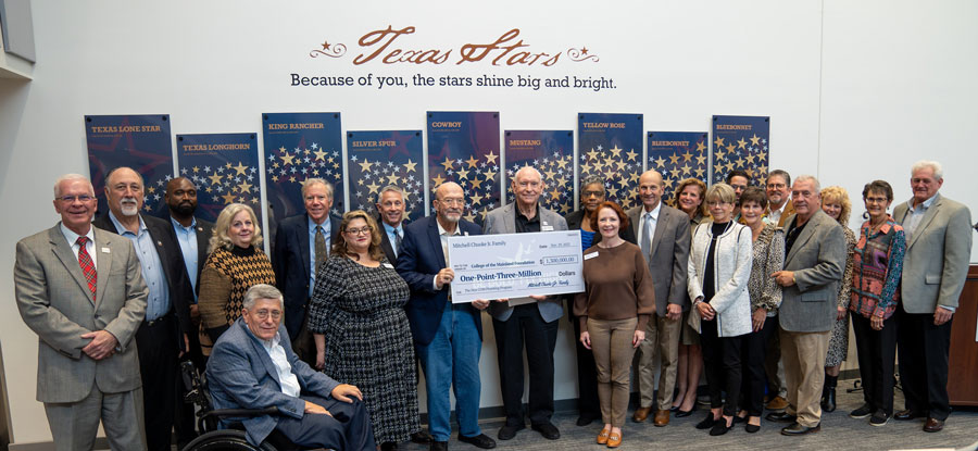 Ceremony where group is receiving a donation check.