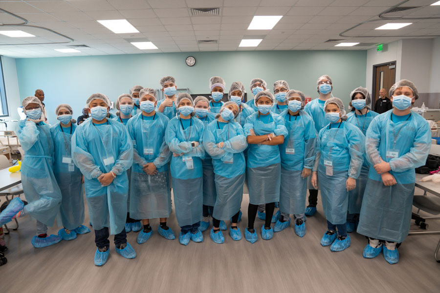 Group of students in medical scrubs.