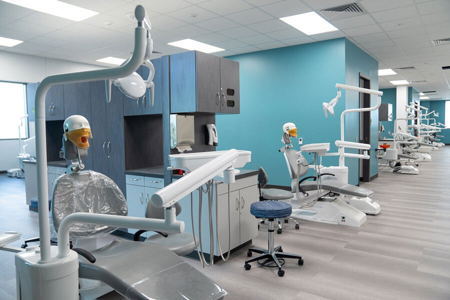 room with dental hygiene chairs and equipment.