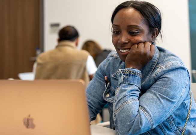 Lady sitting in front of a computer