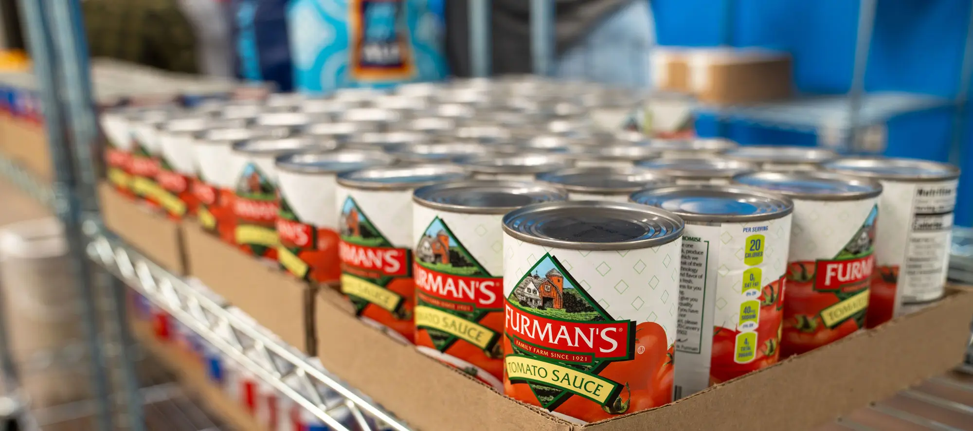 Closeup shot of canned goods on a metal shelf