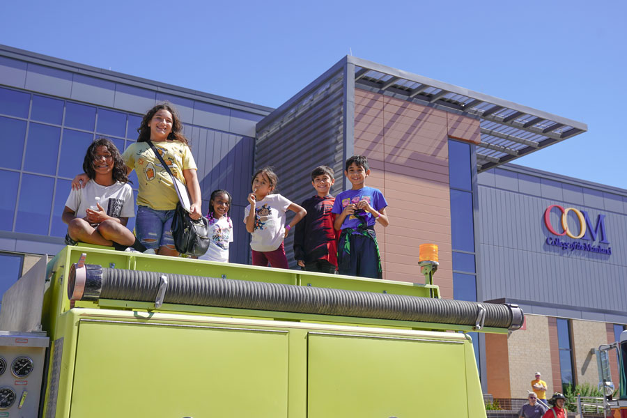 Kids on top a fire truck